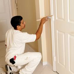 An interior painting contractor detailing a home with paint in Redding
